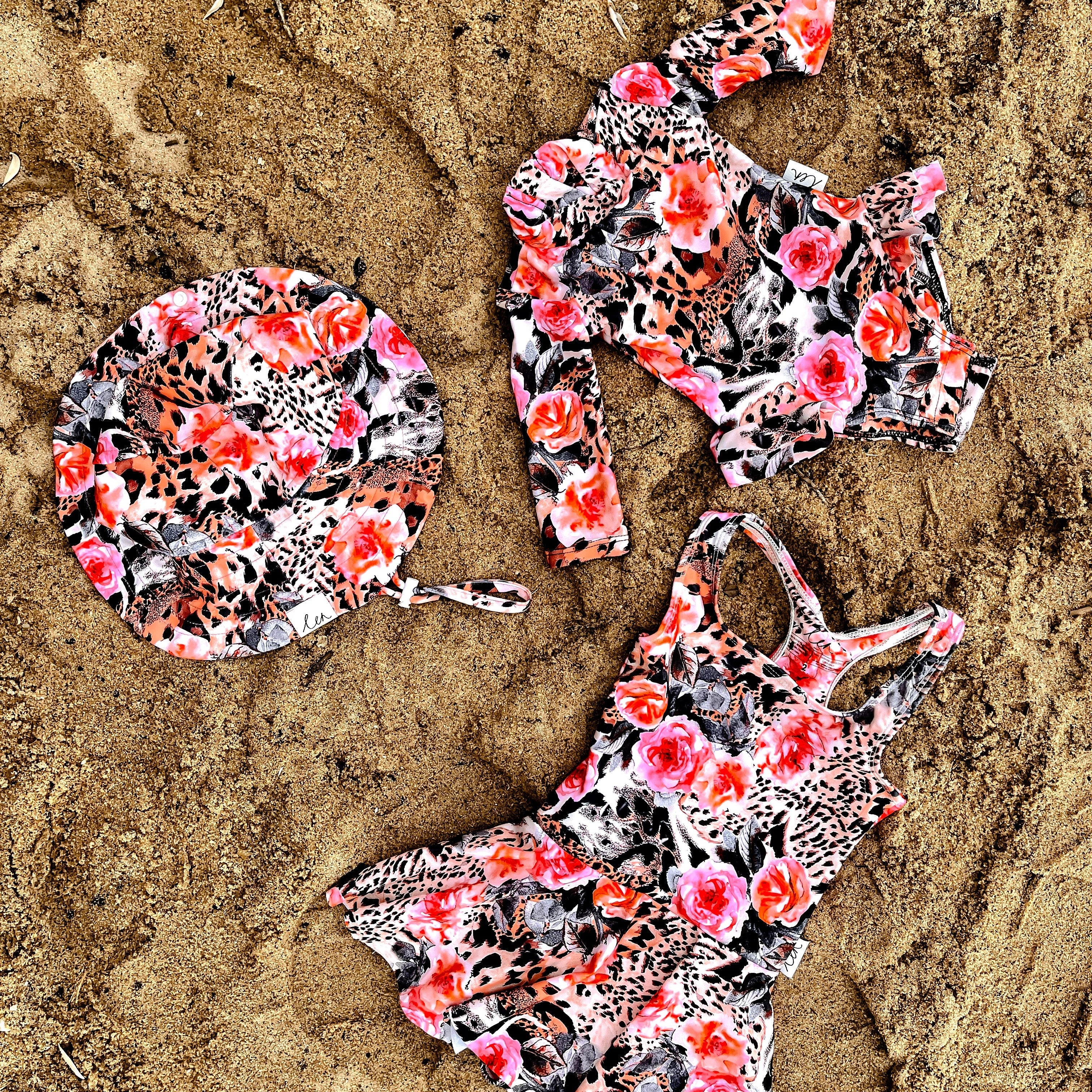 image of infant swimwear and girls swimwear with nappy change snaps swim dresses and hats