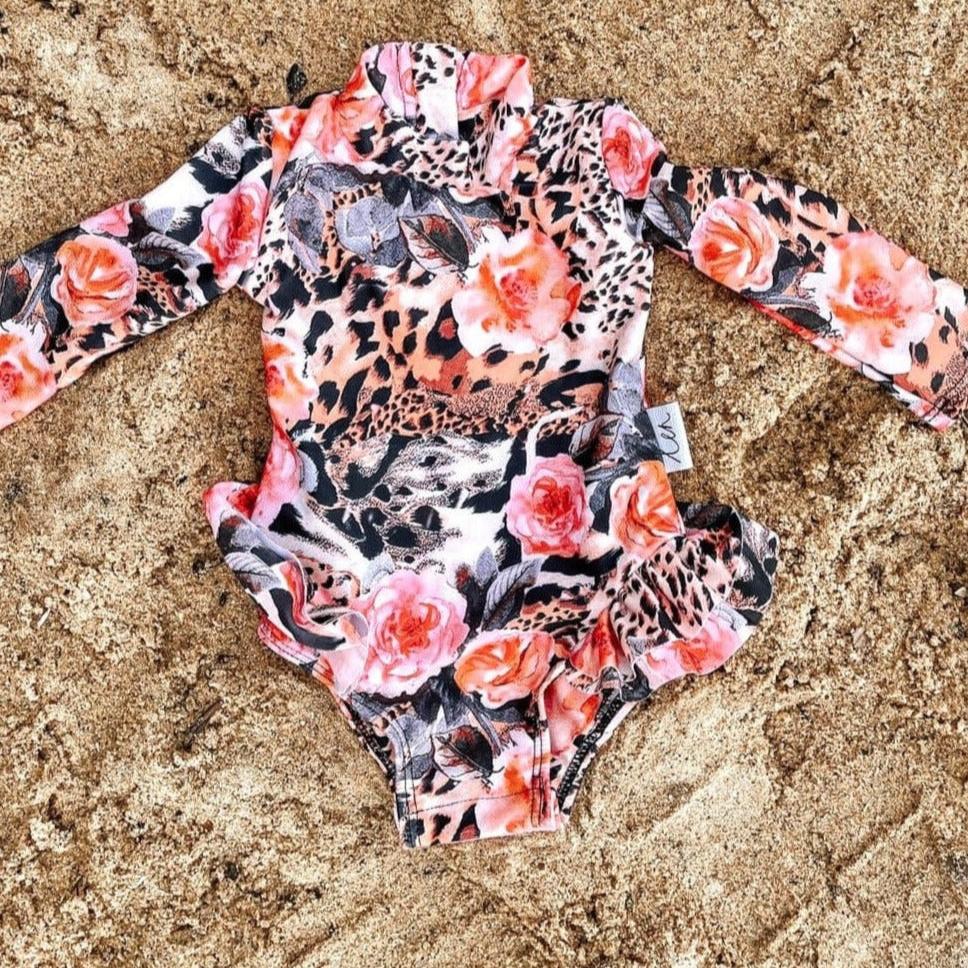 Baby, toddler and girls swimsuit with nappy change snaps in leoaprd print with florals