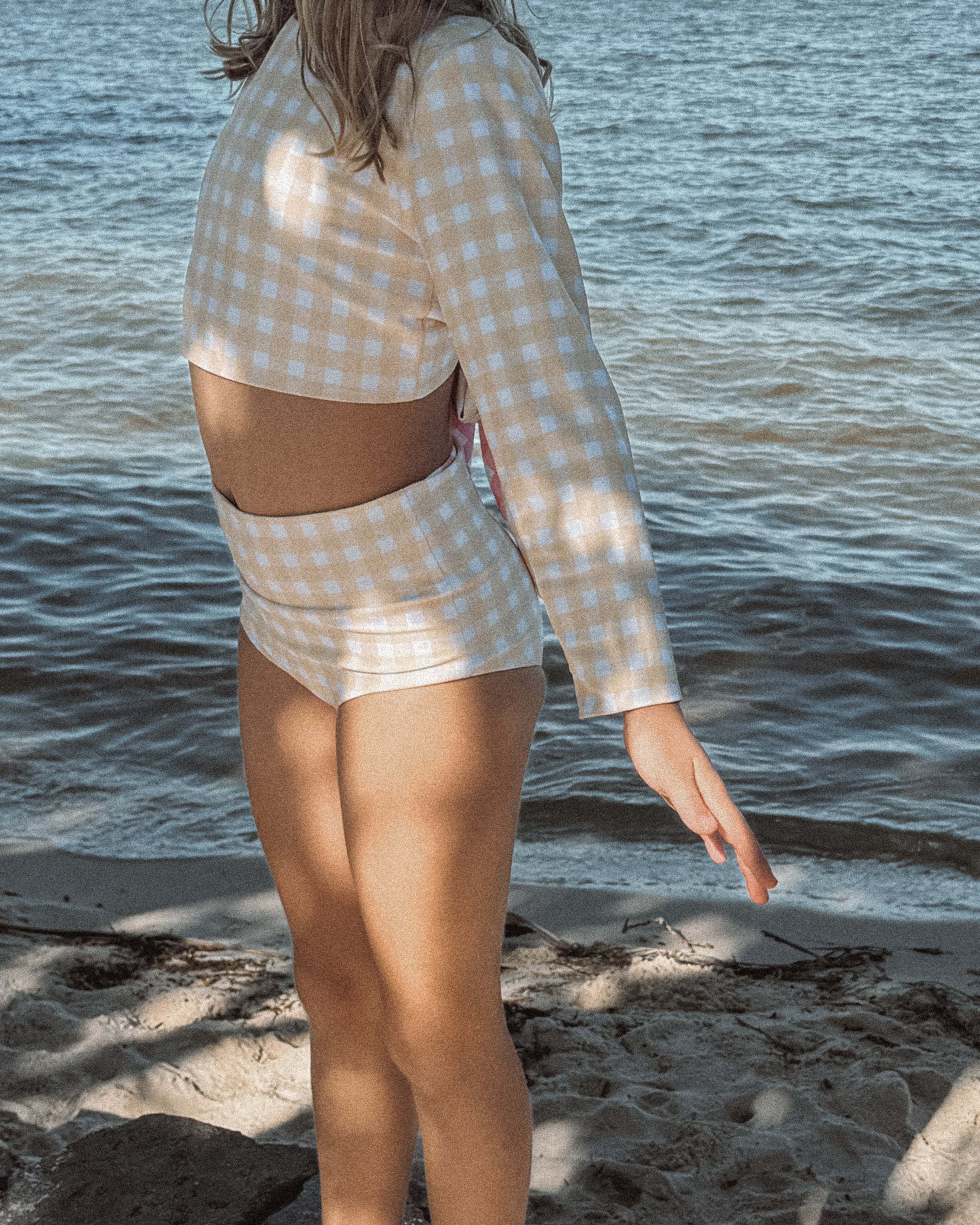 Person girls bathers swimsuit outfit standing by the water