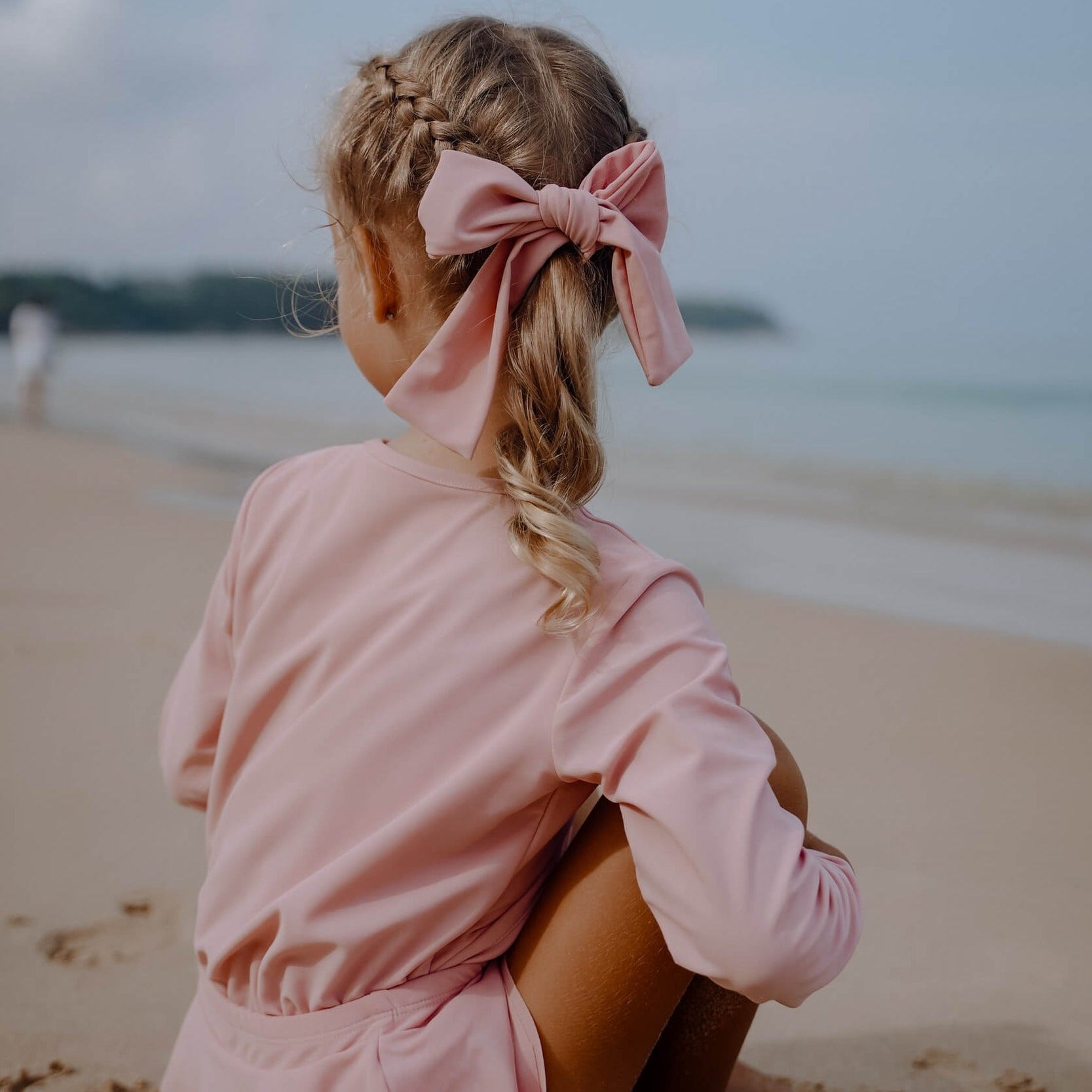 a waterband that can be used as a bow or hair tie. water safe