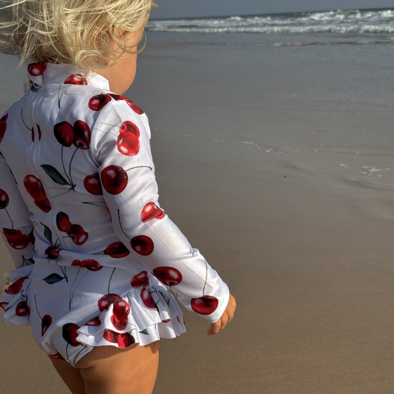 cherry pattern toddler swimsuit with nappy change snaps