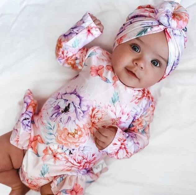 newborn baby girl infant swimsuit in a nappy change swimsuit and matching swim turban with nappy change snaps