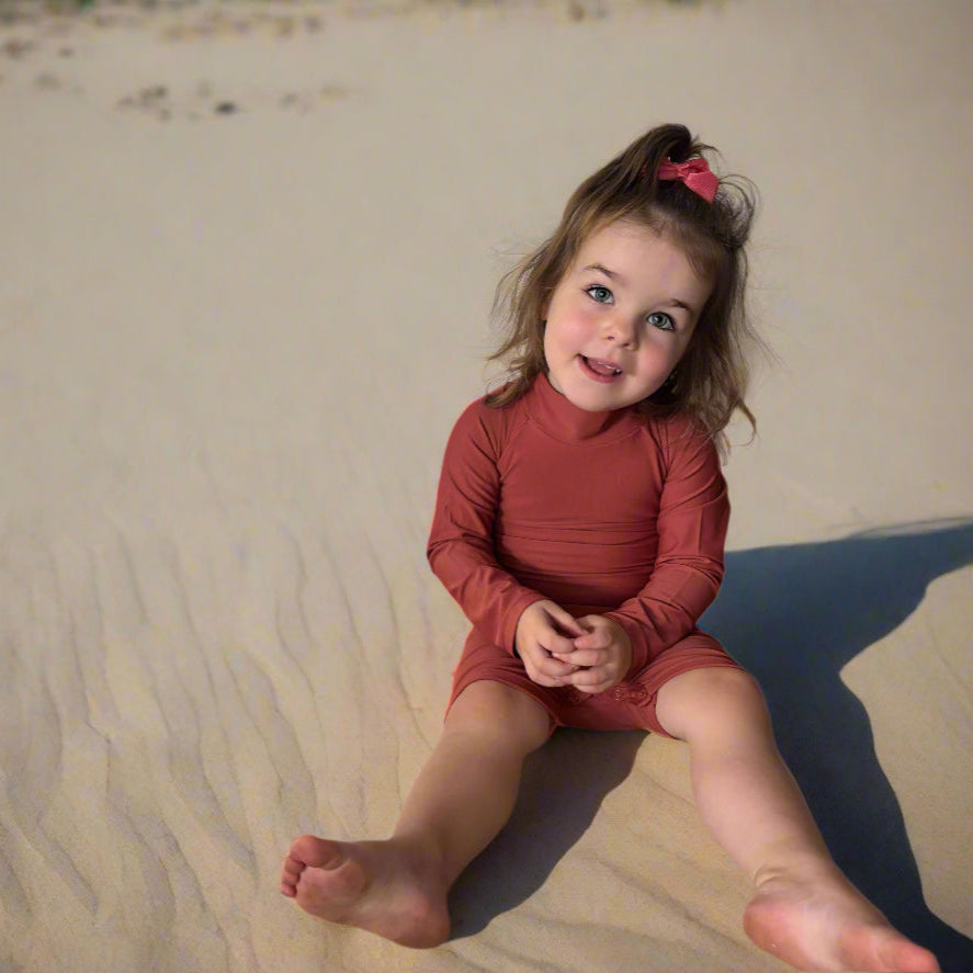 baby girls toddler all on one rashie swimsuit with long sleeves.
