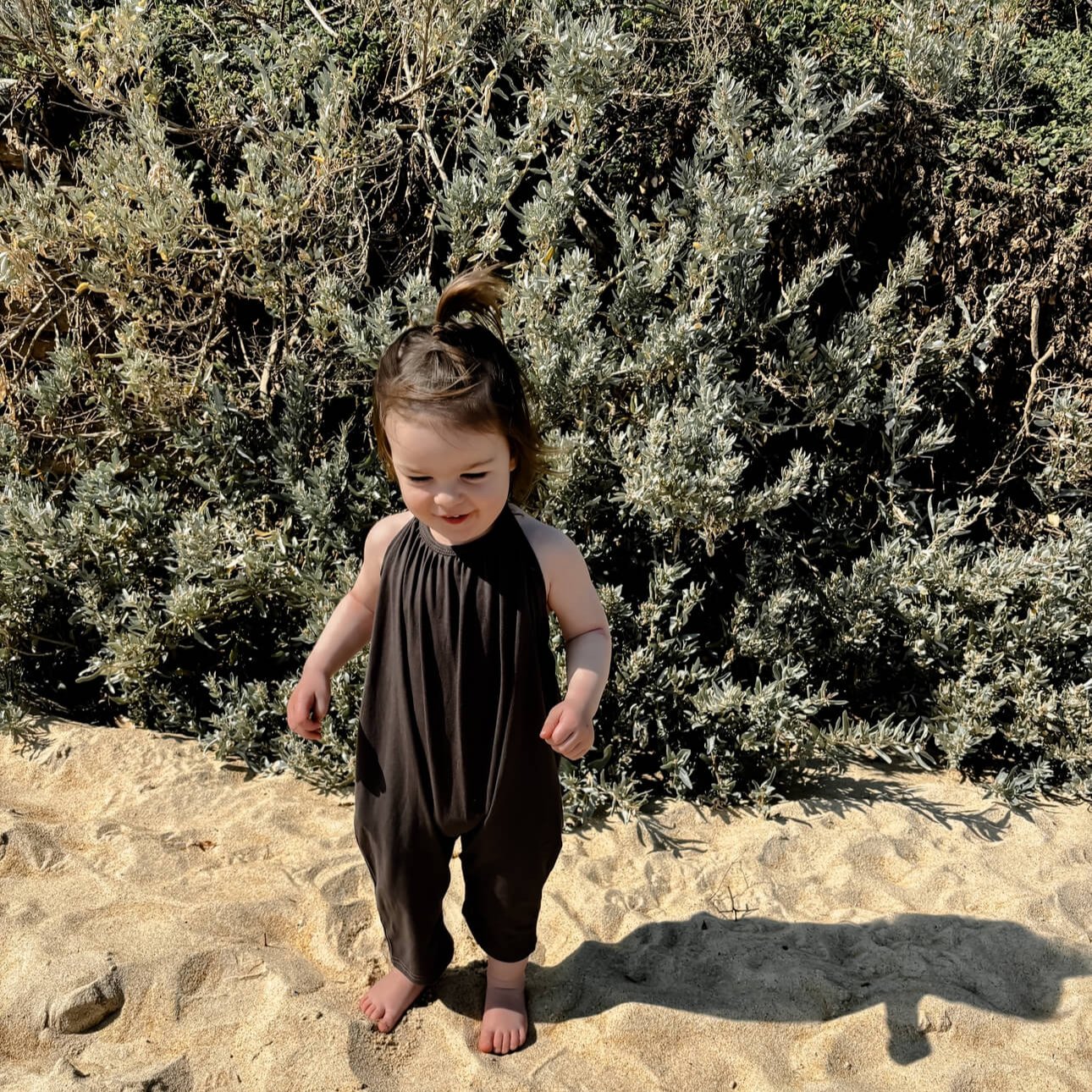 toddler girl in a halter beach cover up