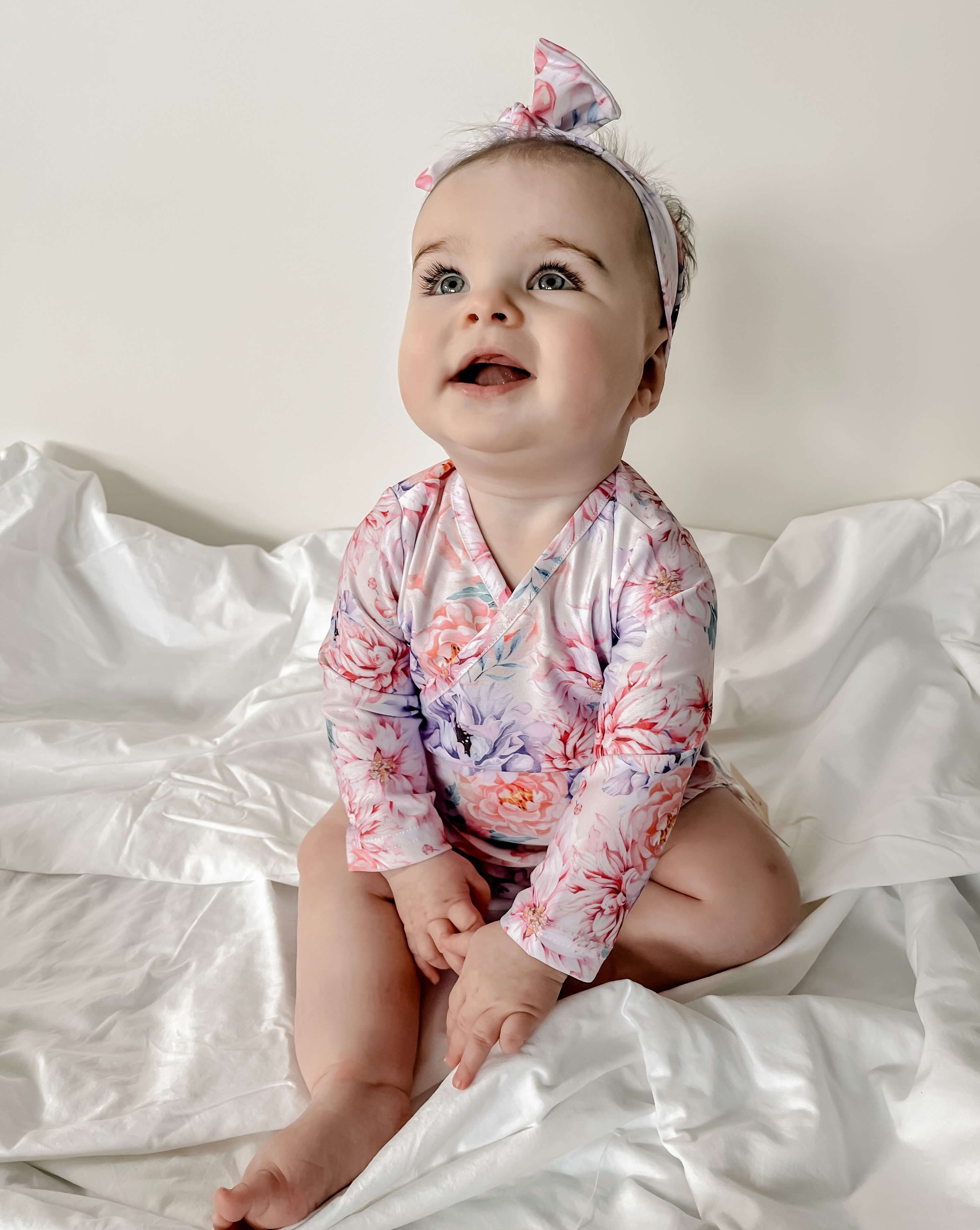 baby girl in long sleeve rash set top and bloomers