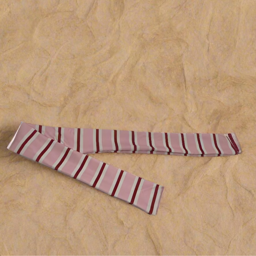 Pink and red striped fabric on a white surface