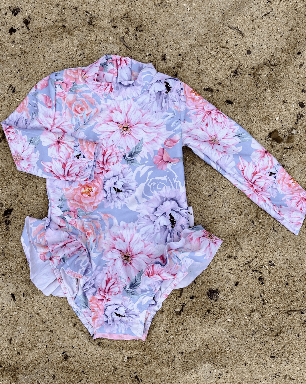 nappy change swimsuit with snaps on a long sleeve bather for baby and toddler girls
