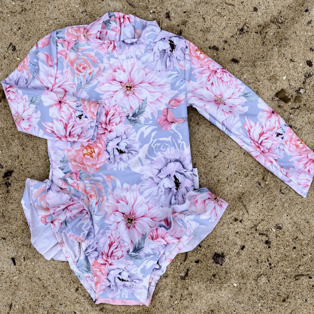 nappy change swimsuit with snaps on a long sleeve bather for baby and toddler girls