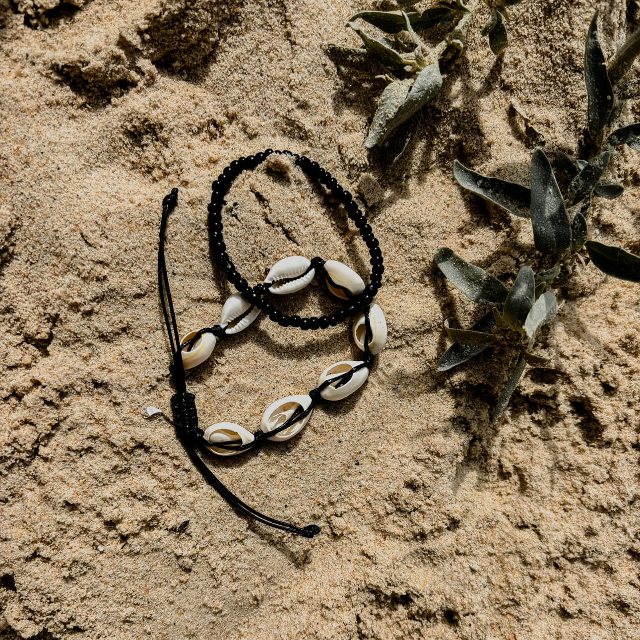 shell and black anklet