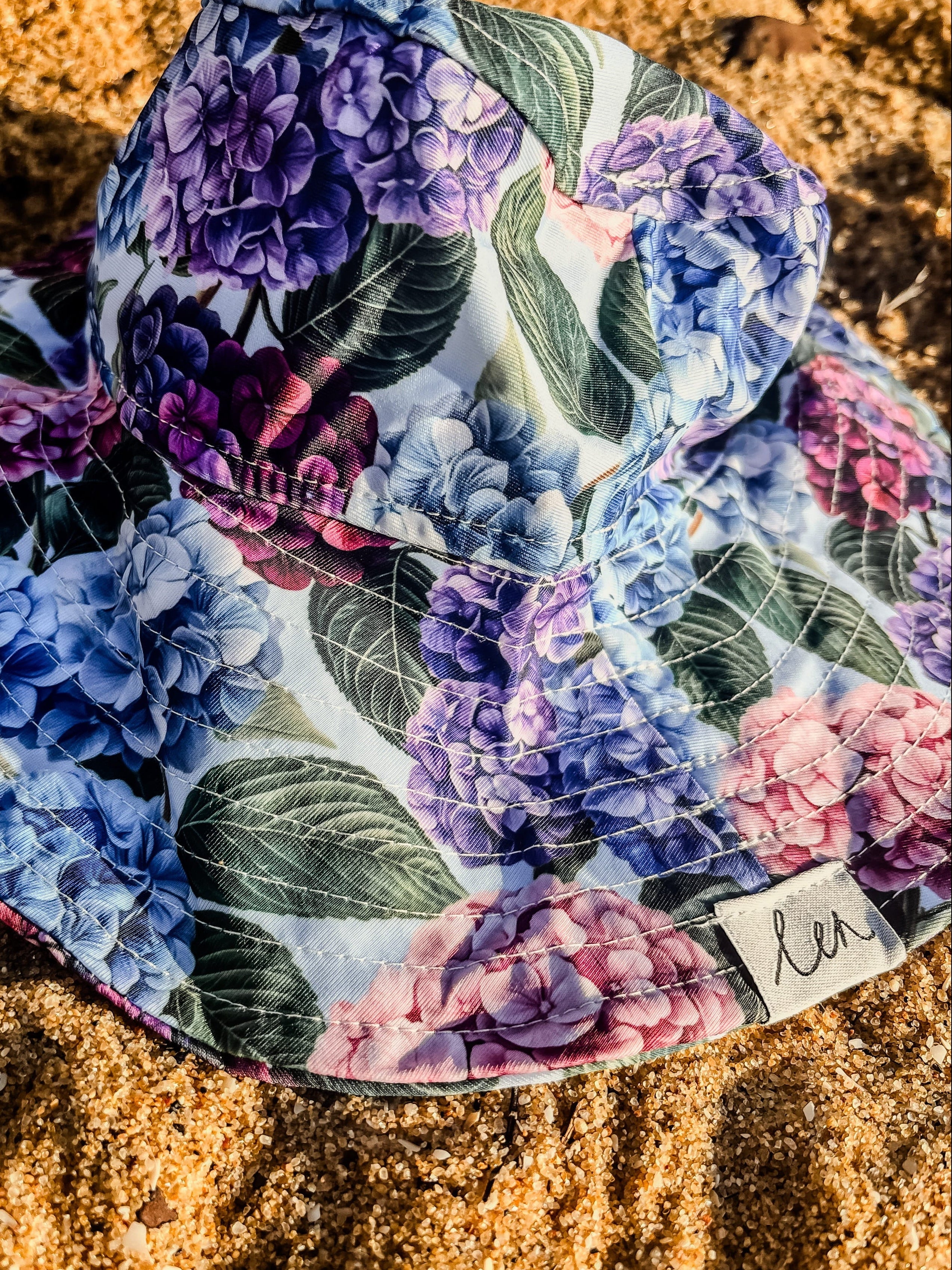 girls swim hat on the sand