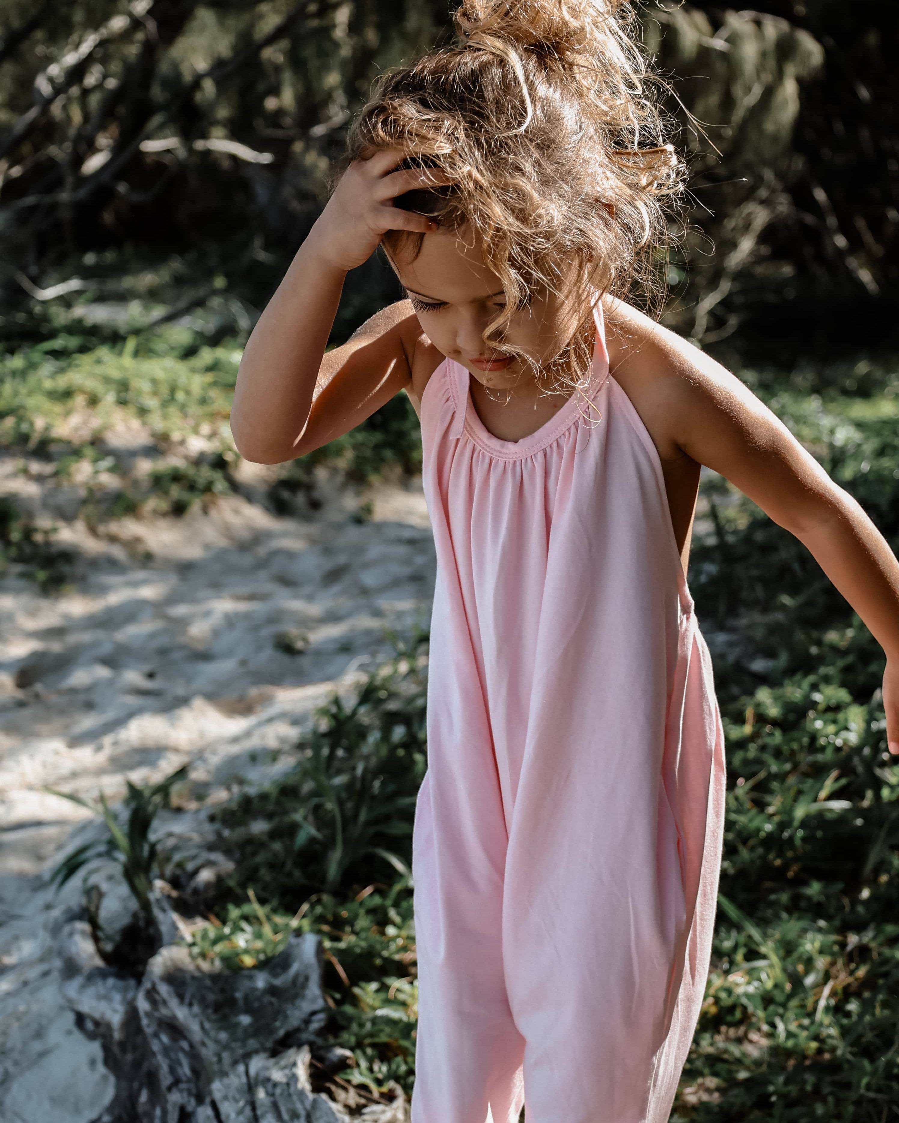 girl in pink beach wear halter summer onesie
