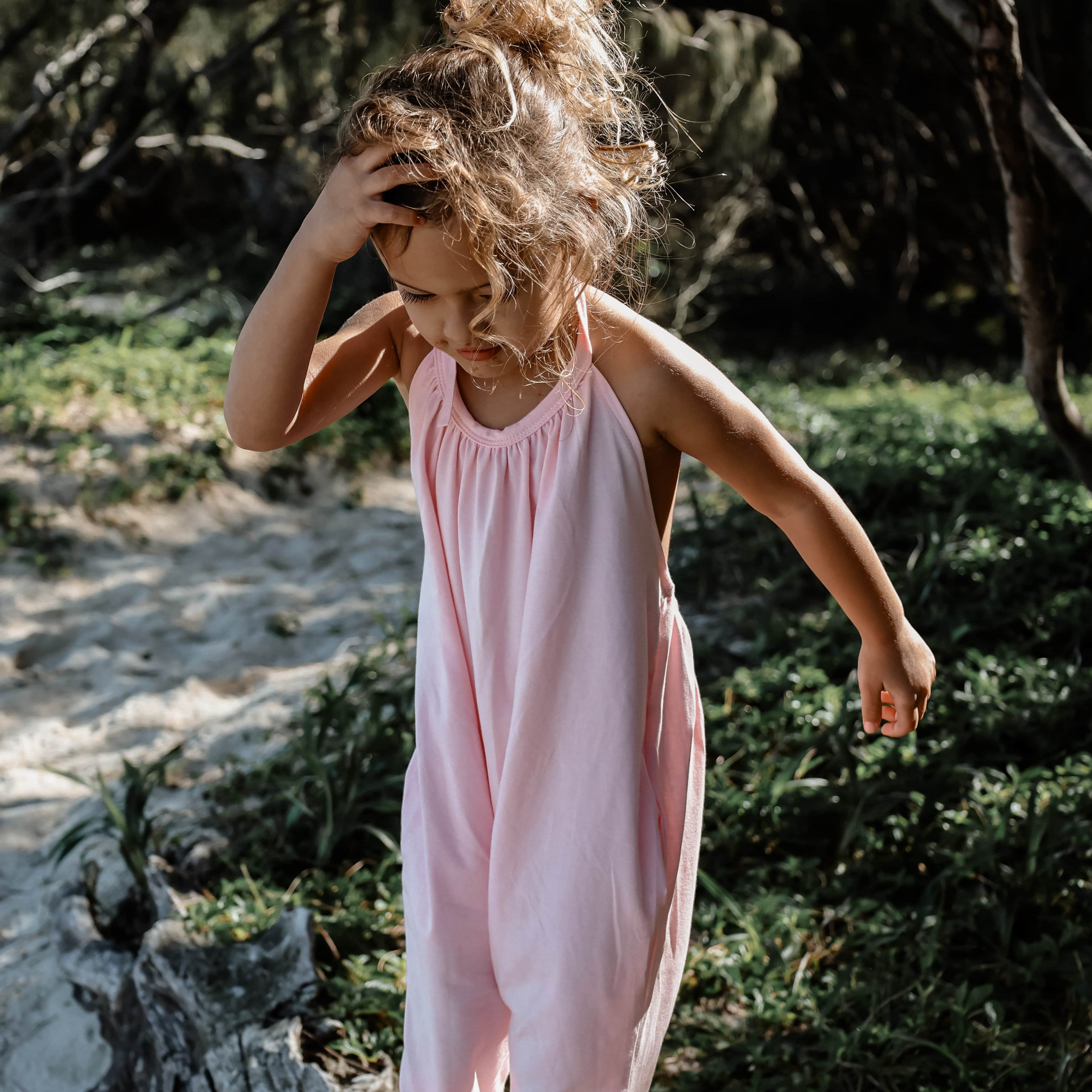 girl in pink beach wear halter summer onesie