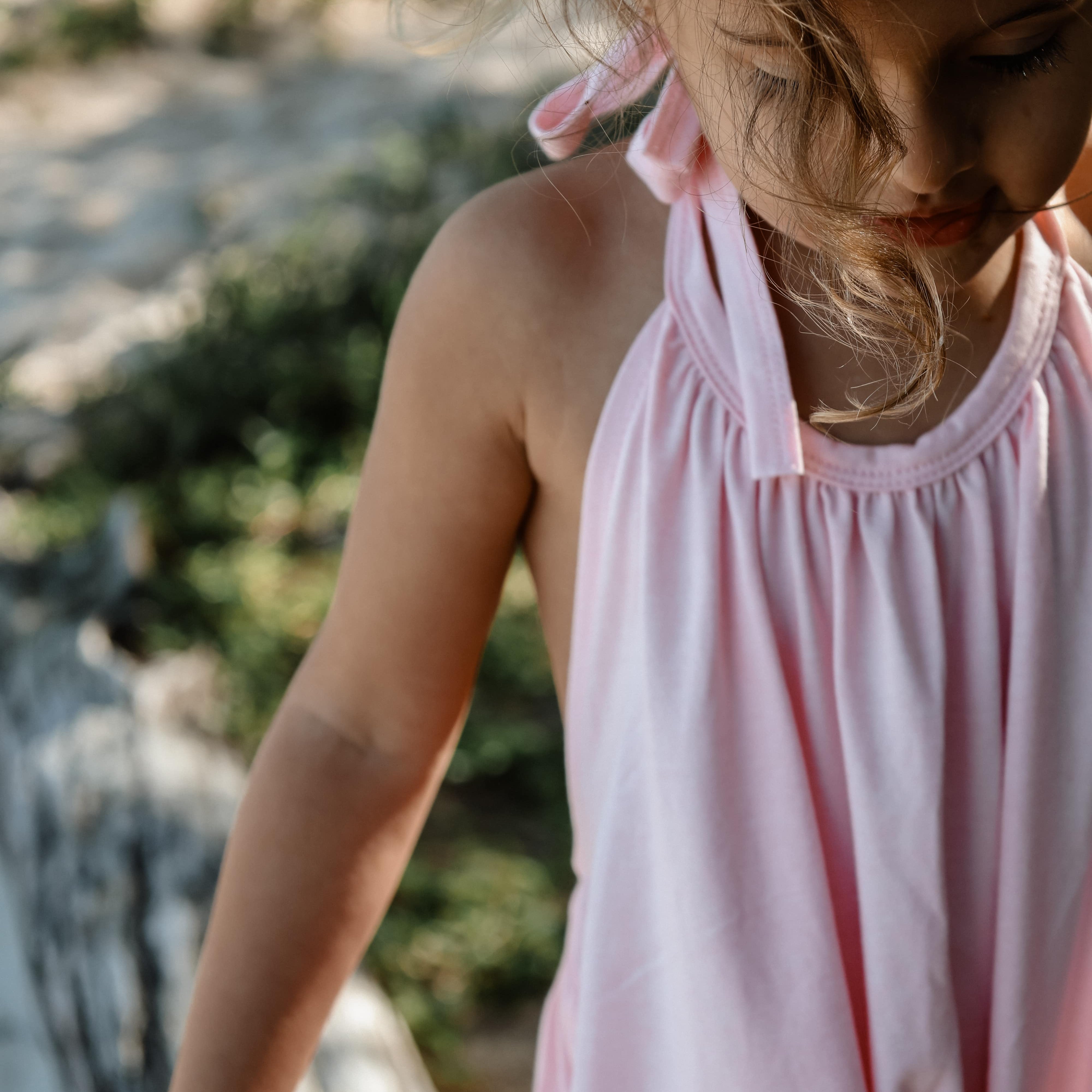girl in pink beach wear halter summer onesie