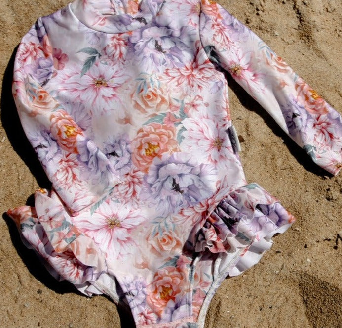 Baby and toddler nappy change long sleeve swimsuit on the beach