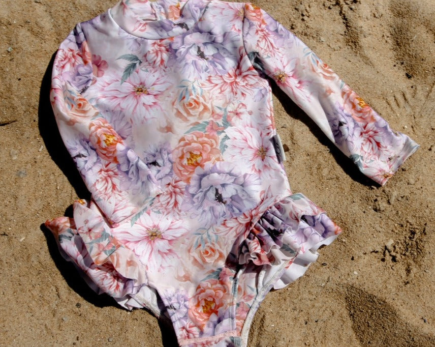 Baby and toddler nappy change long sleeve swimsuit on the beach