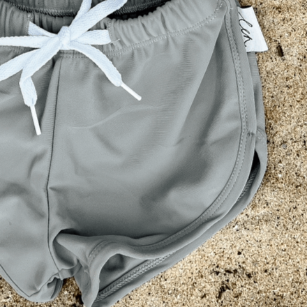 boy and infant swim short in grey