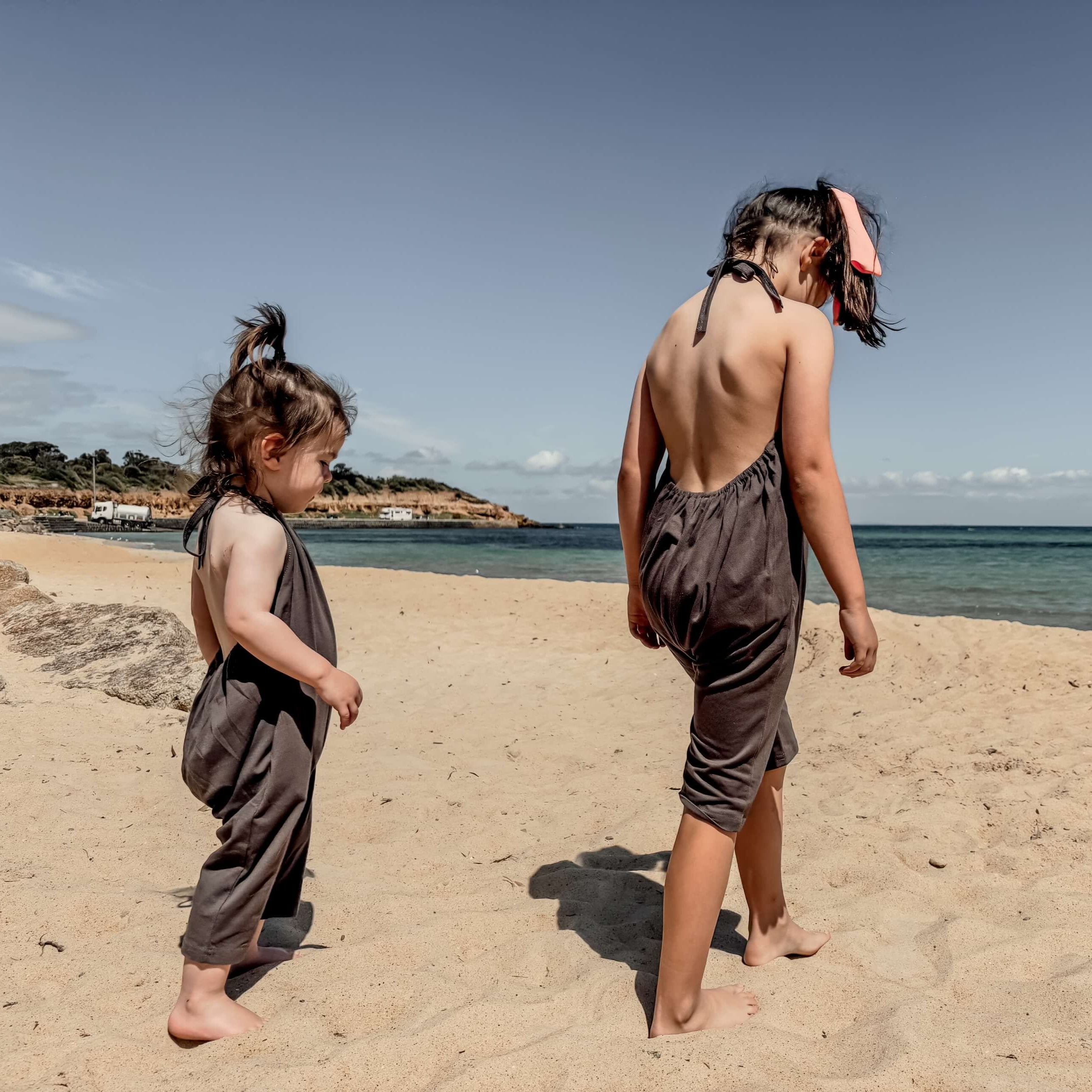 toddler and girl wearing a beach cover up
