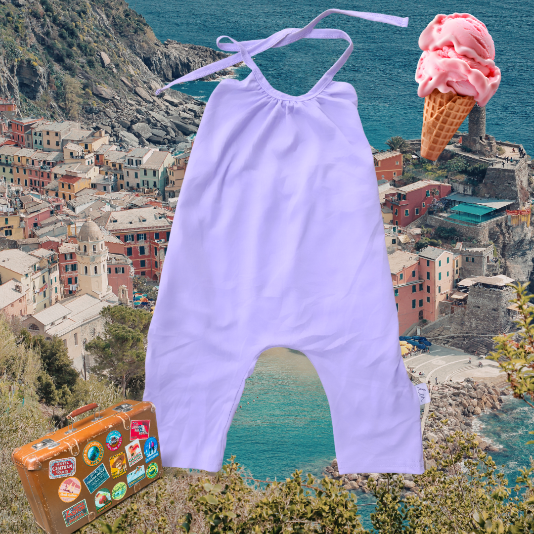 Lavender baby romper with a suitcase and ice cream cone on a scenic background
