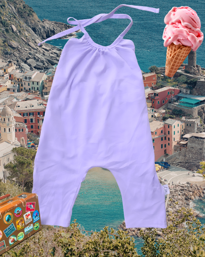 Lavender baby romper with a suitcase and ice cream cone on a scenic background