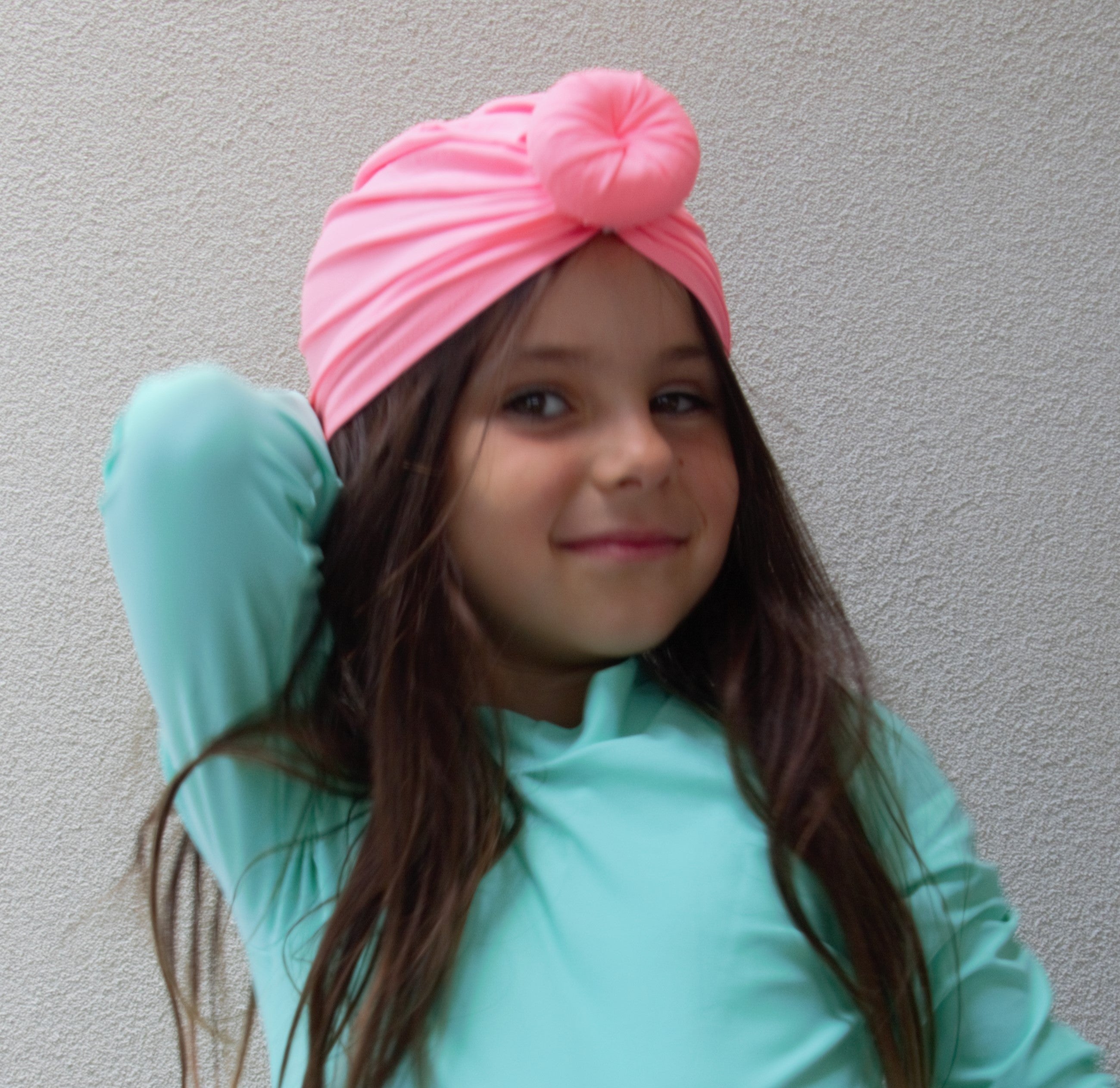 Pink swim safe head turban for a toddler and little girl