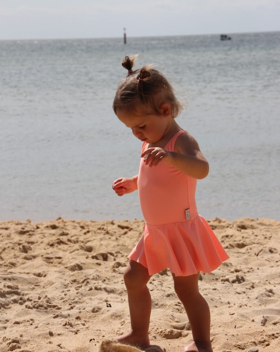 toddler in a swim dress with nappy change snaps